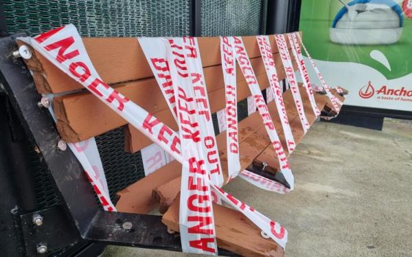 The damaged bus stop at the site of the Half Moon Bay crash.